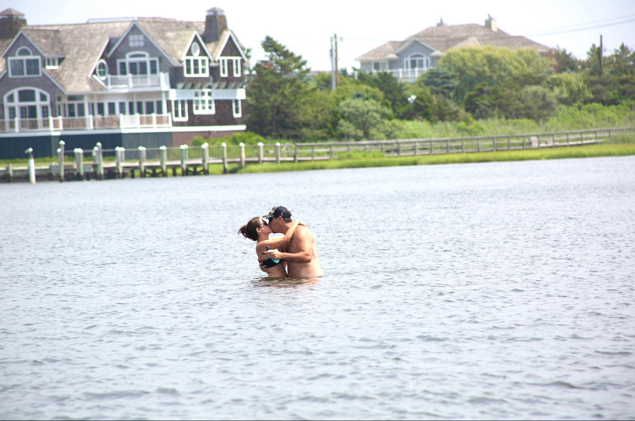 Donald Denihan Jr. and Tiffany Trilli proposal in water Westhampton Long Island